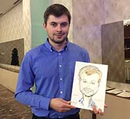 Денис держит лист бумаги со своим рисунком, шаржист Михаил Шабалин, шаржист Мишель